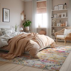 a bedroom with a bed, chair and rug in front of a window on the floor