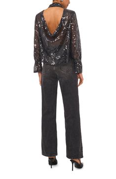 Achieve night-out perfection in this dazzling sequin top punctuated with a drapey open back and fabulously flared long sleeves. 22" length Mock neck Long sleeves with flared cuffs 97% polyester, 3% spandex Hand wash, line dry Imported Glitter Blouse For Night Out In Fall, Glitter Blouse For Night Out, Fall Glitter Blouse For Night Out, Fall Night Out Glitter Blouse, Chic Long Sleeve Glitter Tops, Long Sleeve Sequin Tops For Holiday Party, Glamorous Long Sleeve Blouse For Date Night, Glamorous Long Sleeve Top For Holiday Party, Holiday Party Long Sleeve Sequin Top