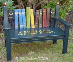 a bench made out of books with cats sitting on them and the caption reads, a cat is a cat and that's that