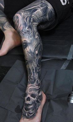 a man with tattoos on his legs and leg