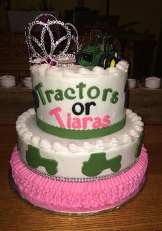 a three tiered cake decorated with tractors or tiaras on top and pink ruffles