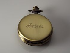 "Personalized pocket watches make great gifts for a birthday, Christmas, graduation, your best man or groomsmen, father of the bride or groom, Father's day, a retirement, or any special occasion! This beautiful watch has a lovely bronze finish, and with the jeweled mechanical movement it truly looks vintage! The front cover has a center cut out with factory embossed roman numerals, and is framed with fancy scrolls. The back cover is smooth and ready to be engraved with a monogram, name, initials Classic Pocket Watch With Stopwatch Feature, Classic Pocket Watch With Stopwatch Feature As Gift, Classic Pocket Watch With Stopwatch As Gift, Harrisburg Pa, Pocket Watches, Roman Numeral, Mechanical Movement, Father Of The Bride, Beautiful Watches