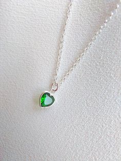 "Sterling Silver necklace with emerald. Size shown is 16\". Please choose your favorite necklace length at checkout. All lengths have a one inch extender, that way you'll have some wiggle room to play with the length. For example, if you choose a 14 inches necklace length, you'll have options to close the necklace at any length between 14 inches and 15 inches. Some of this charms are sold by themselves (no chain). If that option is available for this, you will have the option to buy \"CHARM ONLY Argentium Silver Jewelry, Green Pendant, Green Pendants, Dainty Pendant, Big Rings, Necklace Green, Emerald Necklace, Necklace Heart, Argentium Silver