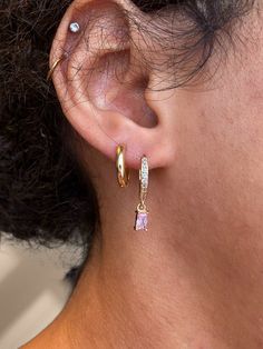 The cubic zirconia version of our barbie pink baguette hoops 💖 they're so sparkly & such a pretty pair of hoops. Perfect for everyday wear and they stack with other earrings so well💕 Materials ✨ The hoops are created with brass, making them more lightweight compared to my stainless steel hoops. The charm is cubic zirconia & both are 18k gold plated so they will keep their gorgeous gold shine ✨ your order will come in a reusable pouch for storage and makes a perfect way to gift.  Sizing:  Hoops Trendy Pink Cubic Zirconia Jewelry, Everyday Pink Huggie Earrings, Trendy Cubic Zirconia Huggie Earrings As Gift, Pink Drop Huggie Earrings, Pink Single Huggie Earring For Everyday, Pink Cubic Zirconia Hoop Earrings, Pink Cubic Zirconia Hoop Jewelry, Pink Dainty Huggie Jewelry, Trendy Cubic Zirconia Hoop Earrings For Gift