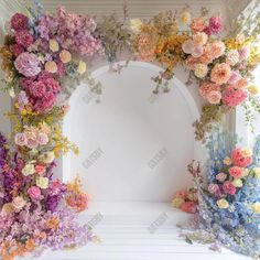 an arch made out of flowers and greenery