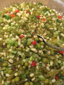 a bowl filled with green beans and other vegetables