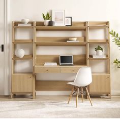 a white chair sitting in front of a wooden desk