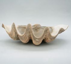 a large white bowl with wavy designs on it