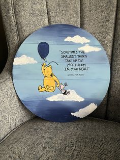 a winnie the pooh painted on top of a chair