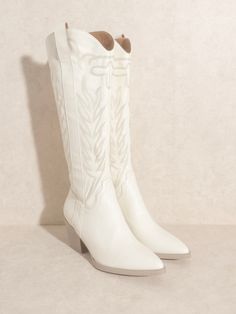 Dare to be different with the Samara White Embroidered Tall Boots! The intricate embroidery adds a bold and unique touch, while the 13.75" shaft and 2.5" heel provide a powerful stance. Zip up and conquer the day with the 0.25" front platform and 15" circumference opening. True to size Cowboy Football, White Cowboy Boots, Perfect Heels, Zipper Heels, Country Concerts, Wrap Heels, Intricate Embroidery, White Boots, Cowboy Boot