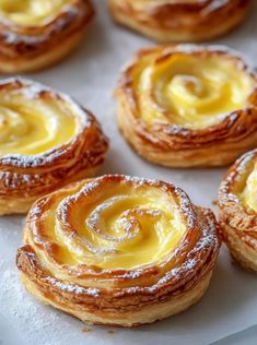 several pastries sitting on top of a white tray