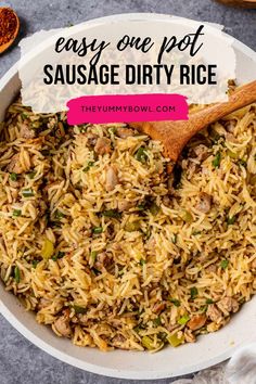 easy one pot sausage dirty rice in a white bowl with a wooden spoon on the side