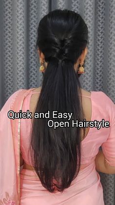 the back of a woman's head with long black hair