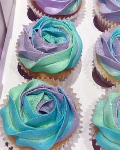 cupcakes decorated with blue and purple frosting