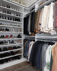 the closet is full of shoes and clothes