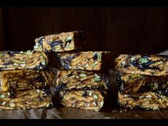 several bars stacked on top of each other with nuts and raisins in them