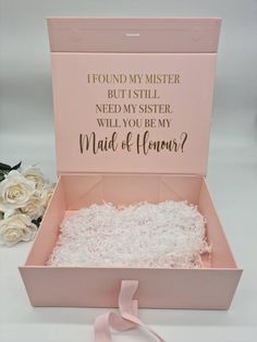 a pink box filled with white flowers and a message on the inside that says, i found my mister