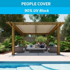 people sitting on couches under a pergolated cover next to a swimming pool