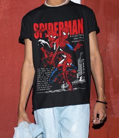 Unisex Spiderman T-Shirt, Spider-Man Shirt, Superhero Shirt, Spiderman Lover Shirt, Retro Family Spider Shirt This classic unisex jersey short sleeve t-shirt fits like a well-loved favorite. Soft cotton and quality printing make users fall in love with it again and again. These t-shirts have ribbed knit collars to reinforce shaping. The shoulders are tapped for a better fit over time. Double side seams maintain the shape of the garment longer. first quality 100% Cotton short sleeve. .: 100% Cott Spiderman T Shirt, Spiderman Tshirt, Spiderman Tshirt Aesthetic, Spider Man Clothes, Spider Man T Shirt, Spiderman Tee Shirt, Graphic Tees Spiderman, Spider Man Graphic Tee, Spider Shirt