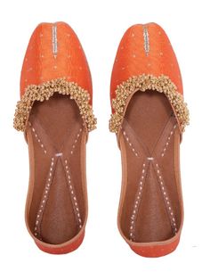 Ghungroo Love - Orange & Gold Silk Juttis By 5 Elements now available at Trendroots Orange Traditional Wear For Festive Transitional Season, Traditional Meenakari Sets For Party, Festive Orange Traditional Wear With Gota Work, Traditional Orange Sets With Gota Work, Festive Orange Traditional Wear With Meenakari, Art Silk Meenakari Traditional Party Wear, Traditional Flat Footwear With Zari Work, Traditional Flat Zari Work Wear, Traditional Wear With Zari Work