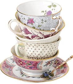 a stack of tea cups and saucers sitting on top of each other