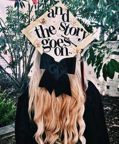 a woman with long blonde hair wearing a graduation cap that says and the story goes on