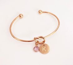 Knot Bracelet, Engraved Initial Bracelet, Birthstone Bracelet Personalized Gifts for Women, Minimalist Jewelry, Adjustable Bangle, Rose Gold Charm Bracelet (Silver and Gold Also Available). Perfect birthday gift for her, bridesmaid gifts or Christmas gift for women and teens. COMES READY FOR GIFT GIVING Rose Gold Plated, Gold Plated or Stainless Steel Knot Bracelet Includes: *Rose gold plated, gold plated or Stainless steel engraved initial charm, 12mm *Genuine Swarovski birthstone, 6mm *Note: January & July Swarovski birthstones are both Siam Adjustable knot bracelet is made with rose gold plated stainless steel, gold plated stainless steel or stainless steel. The wire size is 2mm. The bangle is adjustable to fit approximately 6 to 8 inch wrist. To adjust, it can be stretched to fit over Rose Gold Round Crystal Bracelet As Gift, Rose Gold Round Crystal Bracelet Gift, Personalized Rose Gold Bracelets For Party, Rose Gold Crystal Bangle Bracelet Gift, Personalized Rose Gold Bracelet For Party, Rose Gold Charm Bangle Bracelet As Gift, Adjustable Rose Gold Charm Bracelet As Gift For Her, Adjustable Rose Gold Bangle For Gift, Adjustable Rose Gold Bangle As Gift