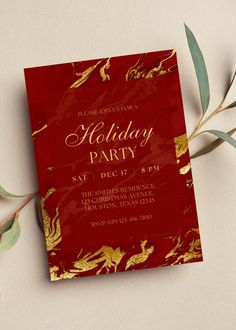 a red and gold holiday party card on a table