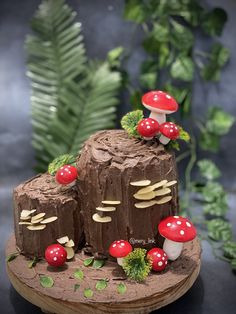 a cake made to look like mushrooms on top of a tree stump with leaves around it