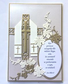 a white and gold card with a cross on it