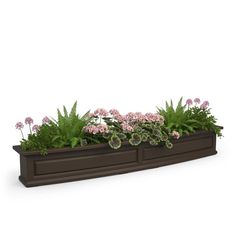 a planter filled with pink flowers and green plants