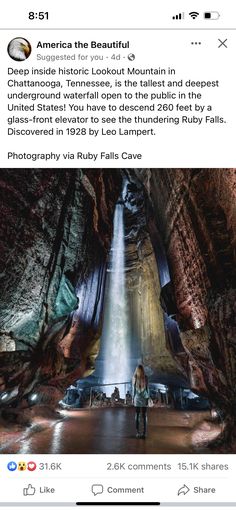 an image of a waterfall in the middle of a cave with people standing around it