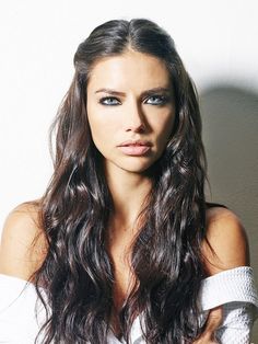 a beautiful young woman with long dark hair