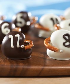 chocolate covered donuts with white frosting and brown icing in the shape of numbers