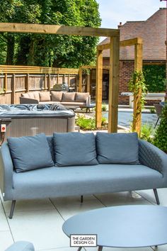 Transform your garden into a luxurious haven with this inviting outdoor seating area, complete with a cosy sofa, hot tub, and pergola for added charm. Perfect for entertaining or enjoying quiet evenings under the stars. Redefine your outdoor lifestyle with comfort and elegance. 🌿🍹 #outdoorliving #gardendesign #gardeninspiration #hottub #seatingarea #gardenideas Cosy Sofa, Outdoor Seating Area