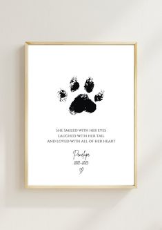 a black and white paw print with the words, she smiled with her eyes and reached with her heart