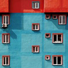 a building with windows and the words run painted on it