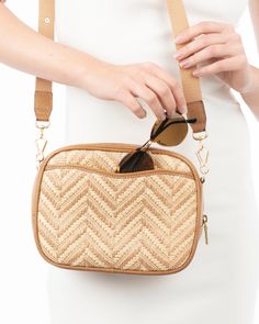 Women's designer zip pouch of woven raffia framed with rich calf leather for sale online is versatile and chic. The compact, "loaf" shape was inspired by old camera cases. The cotton twill webbing strap adjusts to varying lengths to suit your mood and the occasion. Wear it crossbody, as a shoulder bag or detached the strap and Tog Pouch converts to a hand held clutch. An outer pocket on the reverse permits easy access to your phone or glasses.. Inside: durable canvas lining, with dual roomy patc Travel Rectangular Straw Bag With Detachable Strap, Modern Straw Bag With Detachable Strap For Travel, Rectangular Straw Bag With Detachable Strap For On-the-go, Gold Sand, Leather Frames, Old Camera, Woven Raffia, Webbing Strap, Natural Gold