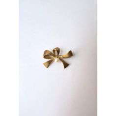 This is part of Chairish’s Fine Jewelry assortment.  A bow and pearl pin brooch in 14 karat yellow gold, in the style of Tiffany & Co., New York, circa 1960s. A beautiful textured 14-karat yellow gold bow with white cultured pearl at center. A great piece for a sweater, coat, blazer, on a blouse, to keep a blouse closed, etc., many uses. Very pretty. Piece is marked '14kt' on back as shown in last image. Very good condition as shown in images. No issues. Dimensions: 1" Height x 1.38" Width.  Ger Mid-century Yellow Gold Brooch For Gifts, Mid-century Gold Brooches For Vintage Events, Gold Bow Brooches For Formal Occasions, Formal Gold Brooch With Bow, Vintage Yellow Gold Brooches For Party, Gold Brooches With Decorative Bow For Gift, Gold Brooch With Decorative Bow As Gift, Vintage Jewelry With Decorative Bow For Formal Occasions, Vintage Formal Jewelry With Decorative Bow