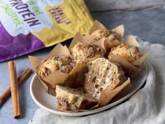 muffins on a white plate with cinnamon sticks next to it and a bag of nutella in the background