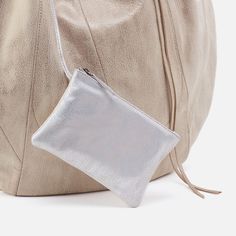 Meet Eclipse Medium. Just like the iconic hobo shape bag you know and love, now in a smaller size that will fit perfectly on your shoulder and under your arm. Inside you’ll find an attached zip pouch in contrasting leather for extra organization! Crafted in a limited edition Metallic Hide, this top-grain leather is buffed for a casual feel and finished with a metallic shine creating the perfect balance of grit and grace. Brushed Antique Brass Hardware Hidden Magnet Closure Interior Front: Slip p Grit And Grace, Antique Brass Hardware, Love Now, Leather Hobo Bag, Zip Pouch, Top Grain Leather, Leather Hobo, Hobo Bag, Drawstring Backpack