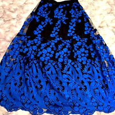 Exquisite All Lace Embroidered Skirt In Bright Blue Floral Arrangement With Black Lining. The Waistband Is Elastic, So Comfort Prevails In Providing Wearability To Such An Elegant Piece. It Doesn’t Have The Tags, But It Is New And Never Worn. Waistband Without Stretch And Then Measurement With Stretch: 13.5” Without Stretch And About 18” With Stretch Length Of Skirt: About 38.5” Long Skirt With Floral Embroidery For Party, Lace Skirt With Floral Embroidery For Party, Party Skirt With Floral Embroidery And Lace, Spring Evening Skirt With Floral Embroidery, Embroidered Party Skirt For Spring, Embroidered Flowy Party Skirt, Embroidered Flowy Skirt For Party, Embroidered Party Skirt, Black Floral Embroidered Skirt For Parties