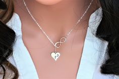 Sterling Silver Infinity Baby Footprint Necklace. It is perfect gift for New Mom, Baby Shower. The Model wearing 17", it could be shorter or longer depend on customer's request from " Necklace Length " drop down box as you check out. It consists of... -13.7x13.5mm Footprints Heart, Closed Jump Ring -Sterling Silver Infinity link, -Sterling Silver cable chain with spring claw, -Come up with small ribbon gift box, and -One Set of Care instruction package. -Total length will be 15",16", 17",18" ,19 Personalized White Heart Necklace For Mother's Day, White Hand Stamped Jewelry For Mother's Day, Adjustable Personalized Heart Necklace For Mother's Day, Personalized Adjustable Heart Necklace For Mother's Day, Footprint Necklace, Baby Footprint, Ribbon Gift, Baby Footprints, New Mom Gift