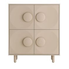 a white cabinet with four circles on it