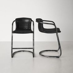 two black chairs sitting next to each other