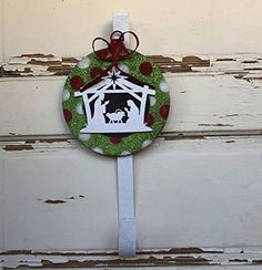 a christmas ornament hanging from the side of a door