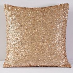 a pink pillow that is covered in sequins