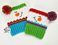 two knitted mittens with snowmen on them