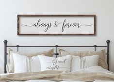 a bed with pillows and a sign above it that says you will forever be my always