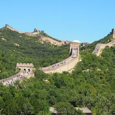 the great wall of china with people walking on it